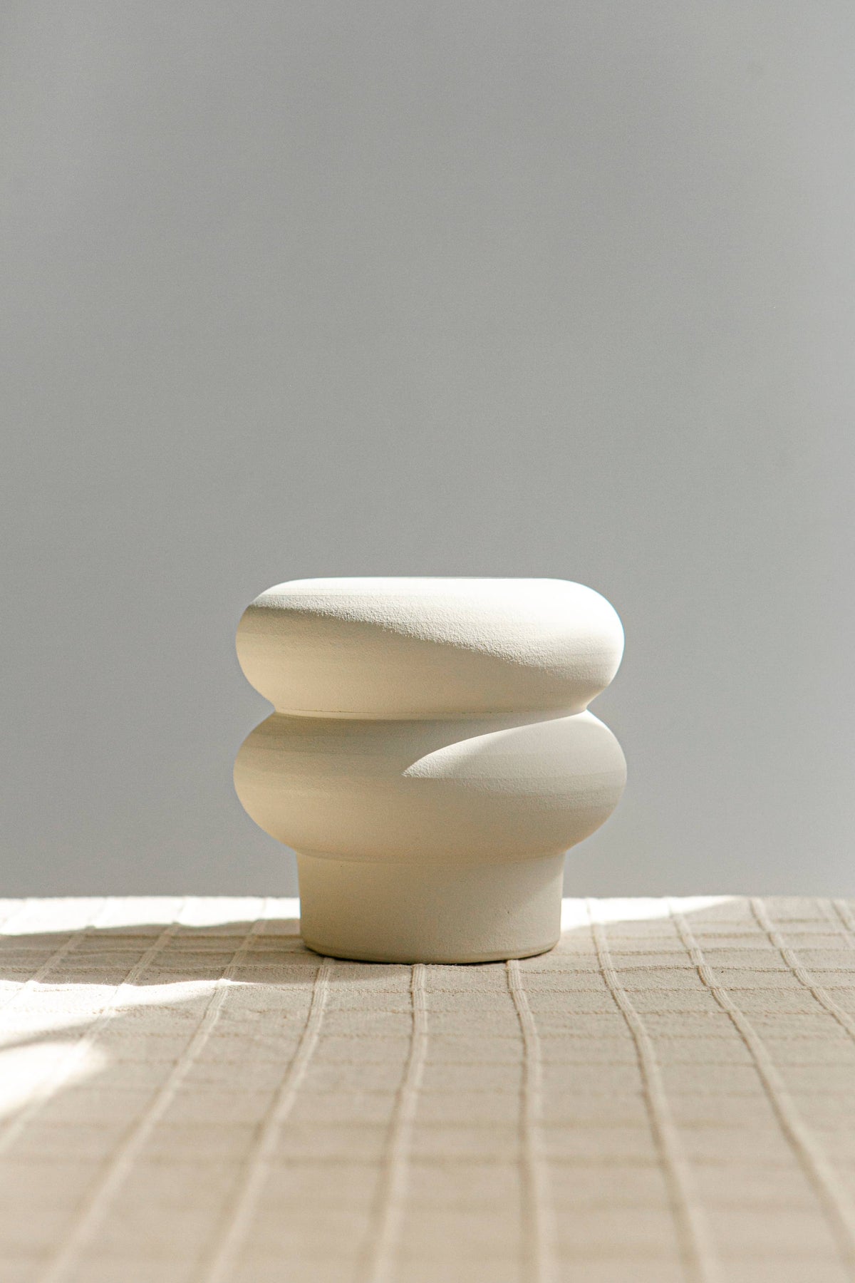 Small ripple-textured vase in off-white